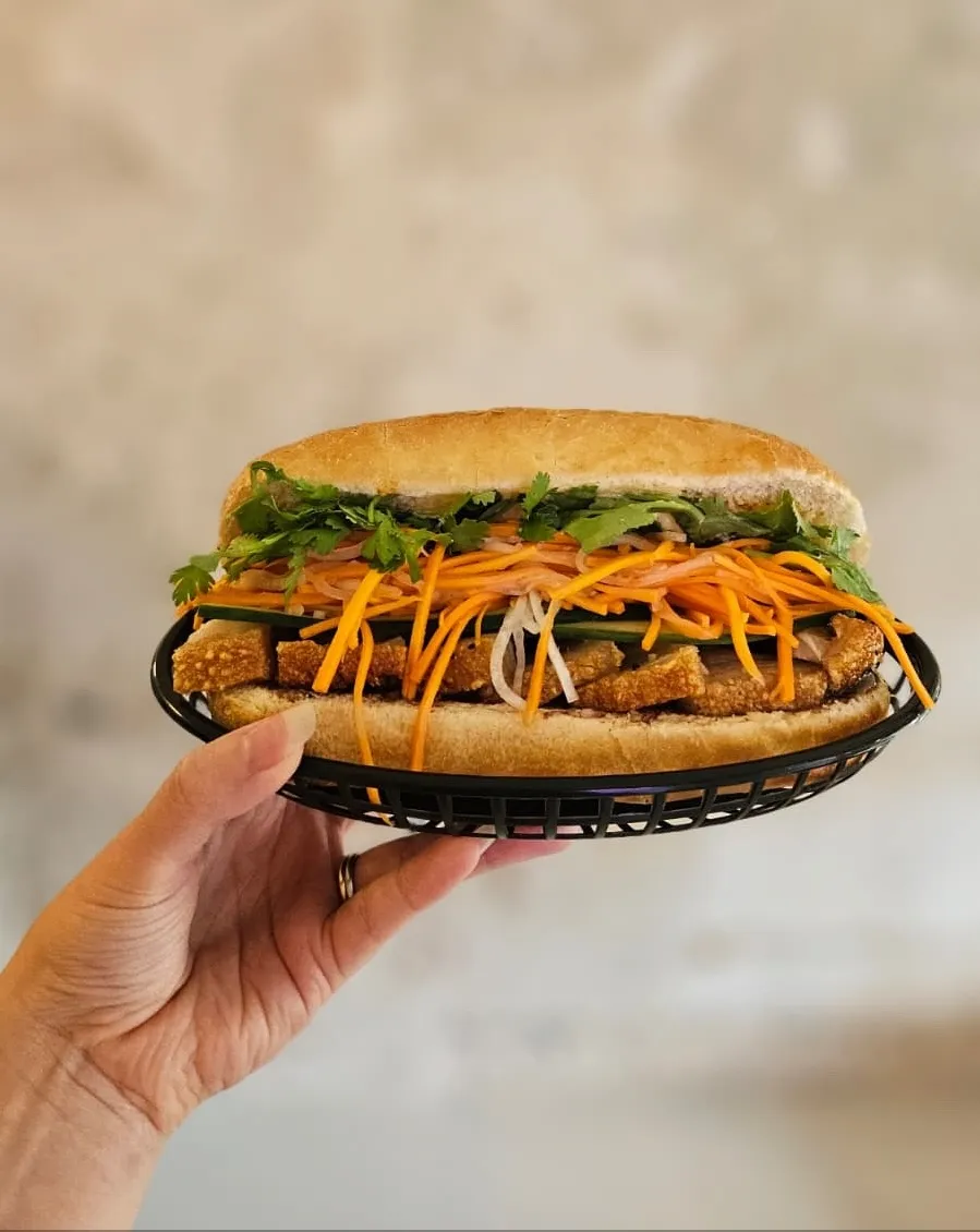 A Bánh Mì held in one hand